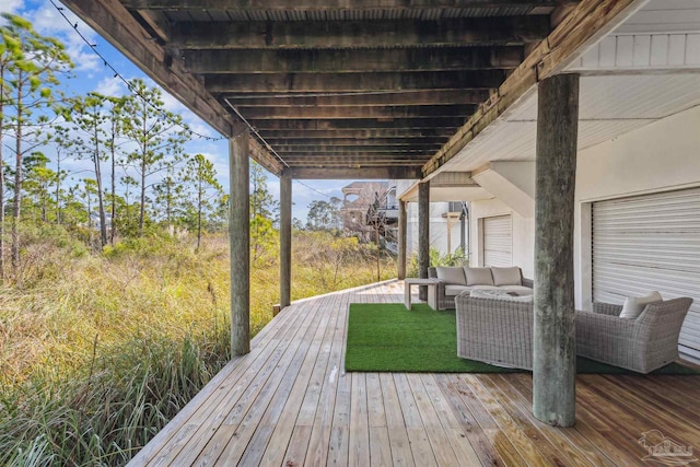 wooden deck featuring an outdoor living space