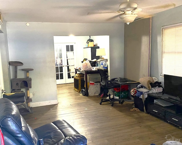 living room with french doors, hardwood / wood-style flooring, and ceiling fan