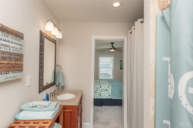 bathroom with ceiling fan and vanity