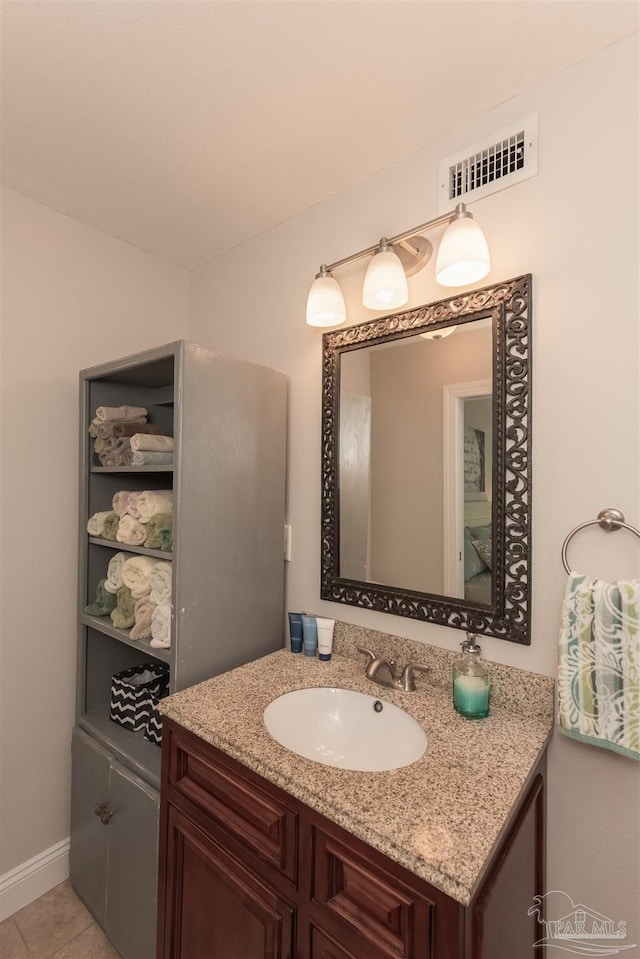 bathroom with vanity and tile patterned floors