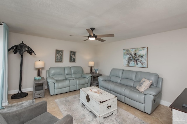 tiled living room featuring ceiling fan and a textured ceiling