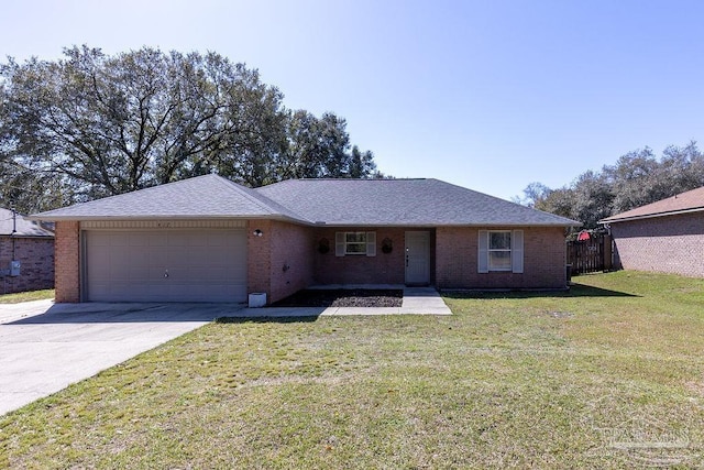 ranch-style house featuring concrete driveway, brick siding, an attached garage, and a front yard