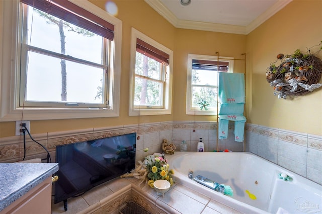 bathroom featuring crown molding, vanity, and tiled bath