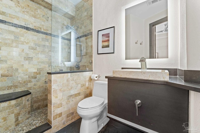 999 Ft Pickens Rd Unit 309, Pensacola Beach, FL 32561 - bathroom with vanity, toilet, and tiled shower