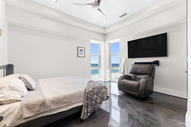 999 Ft Pickens Rd Unit 309, Pensacola Beach, FL 32561 - bedroom featuring access to exterior, concrete flooring, a raised ceiling, and ceiling fan