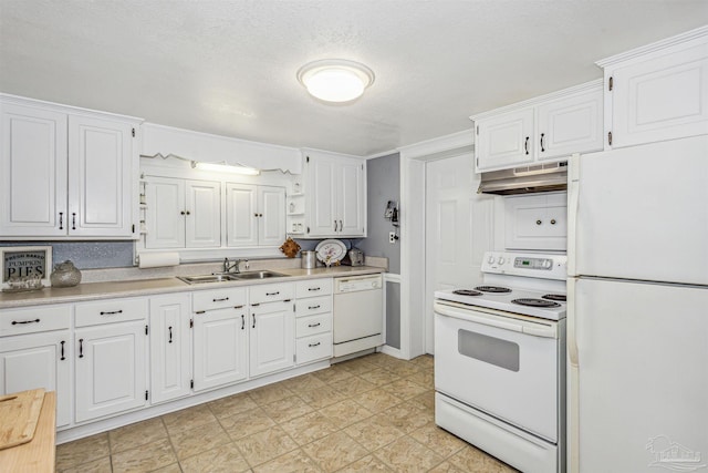 kitchen with white cabinets and white appliances