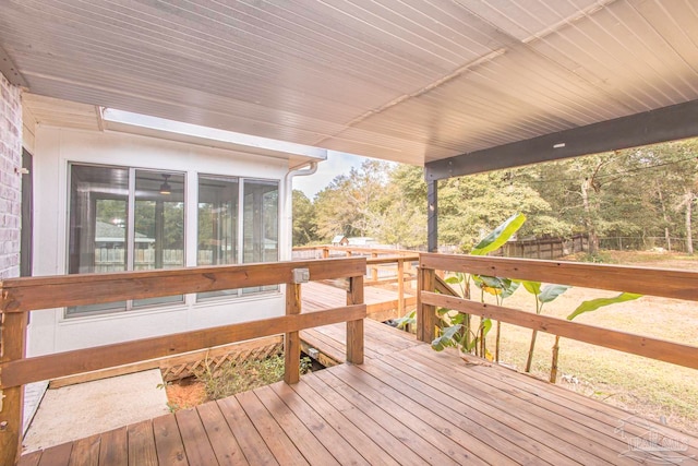 deck with a sunroom