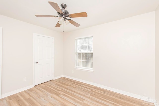 empty room featuring ceiling fan and light hardwood / wood-style flooring