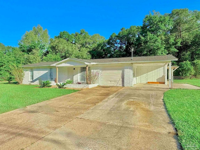 single story home with a garage and a front lawn