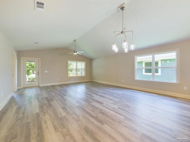 unfurnished living room with lofted ceiling, visible vents, a ceiling fan, light wood-type flooring, and baseboards