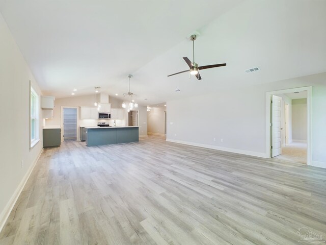 unfurnished living room with baseboards, visible vents, lofted ceiling, ceiling fan, and light wood-style floors