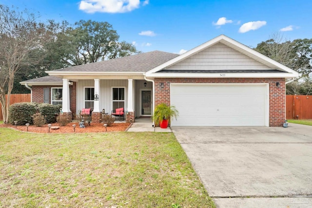 view of front of home with brick siding, an attached garage, and a front lawn