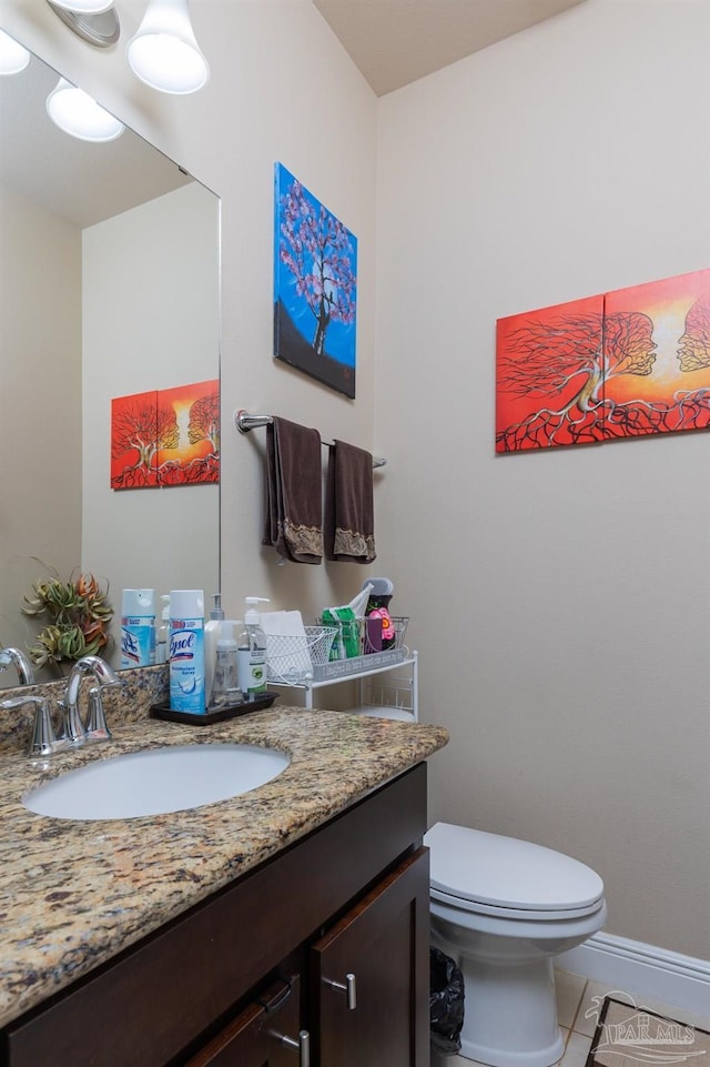 half bath with visible vents, baseboards, toilet, tile patterned flooring, and vanity