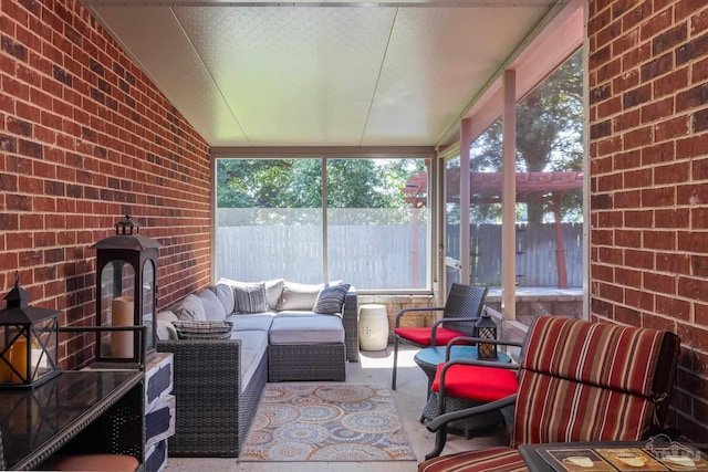 sunroom / solarium with vaulted ceiling