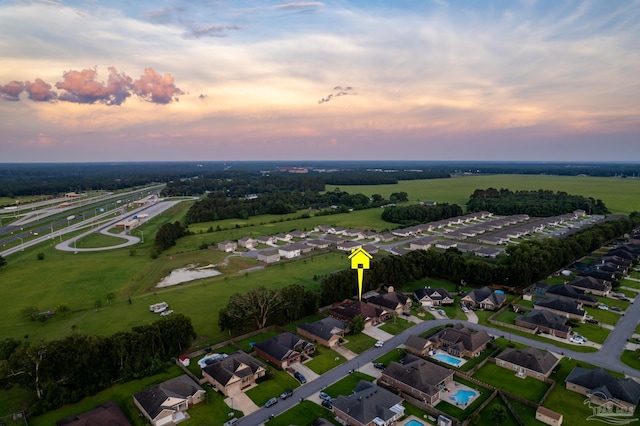 aerial view at dusk with a residential view