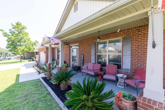 view of patio / terrace with covered porch and an attached garage