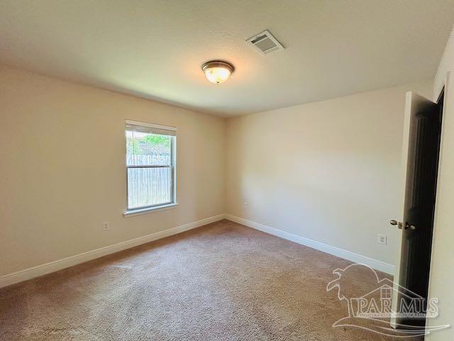 5643 Flume Dr, Pace, FL 32571 - unfurnished room with baseboards and carpet flooring