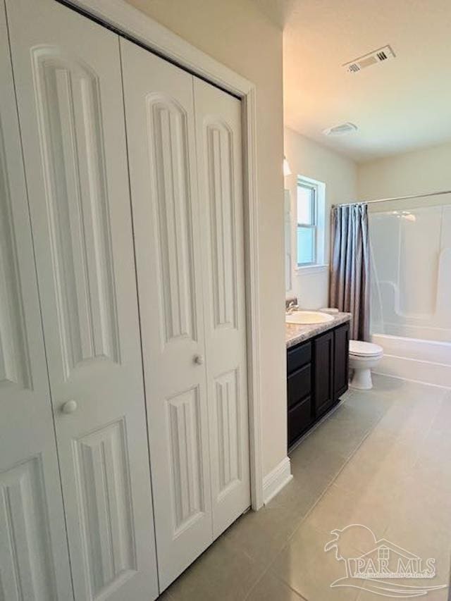 5643 Flume Dr, Pace, FL 32571 - full bath with tile patterned floors, toilet, a closet, shower / tub combo, and vanity