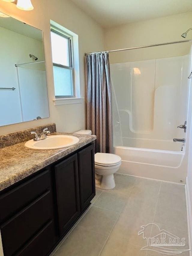 5643 Flume Dr, Pace, FL 32571 - bathroom featuring shower / tub combo, vanity, toilet, and tile patterned floors