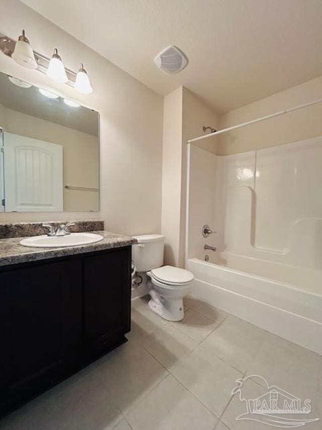 5643 Flume Dr, Pace, FL 32571 - bathroom with toilet, vanity, tile patterned floors, and shower / tub combination