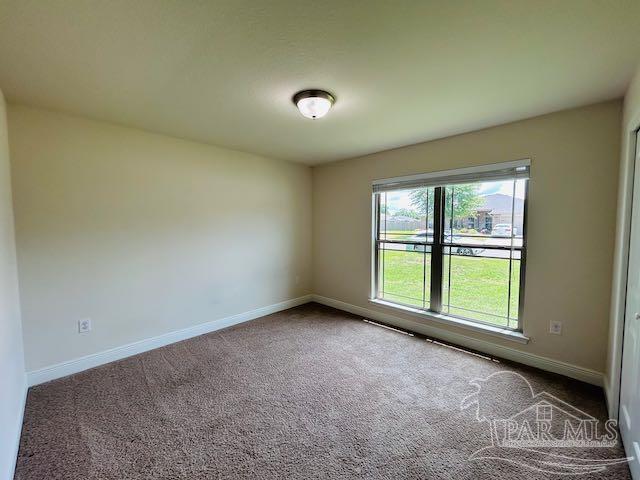 5643 Flume Dr, Pace, FL 32571 - unfurnished room featuring carpet flooring and baseboards