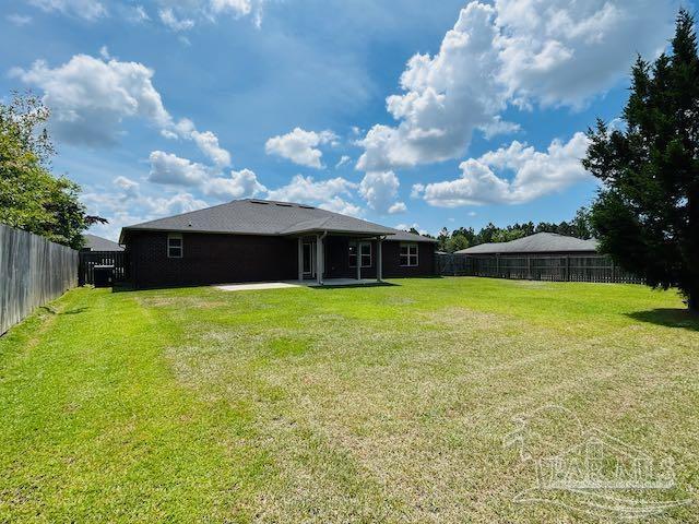 5643 Flume Dr, Pace, FL 32571 - view of yard with a patio