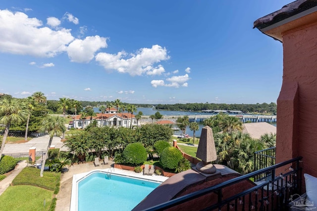 view of pool featuring a water view