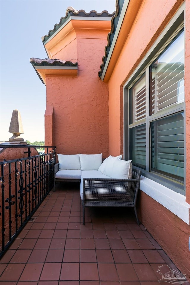 view of patio featuring a balcony