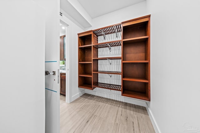 mudroom with light hardwood / wood-style floors