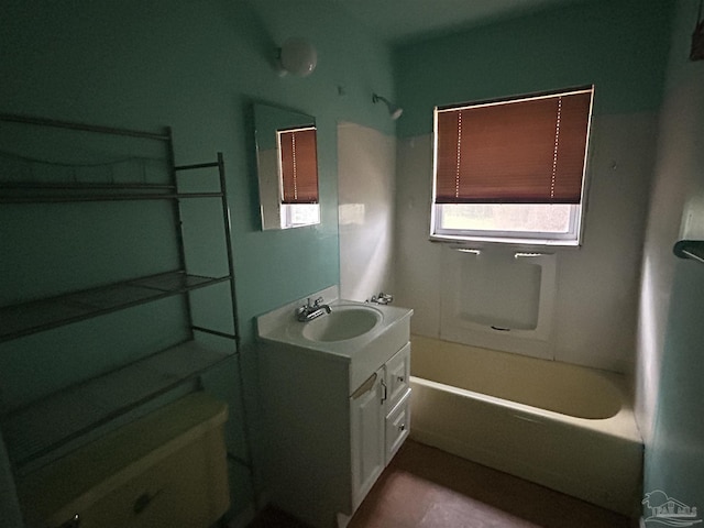 bathroom featuring tub / shower combination, toilet, and vanity