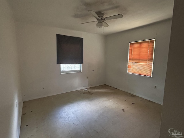 spare room with ceiling fan