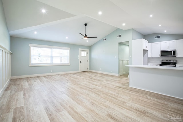 unfurnished living room with light hardwood / wood-style floors, ceiling fan, and lofted ceiling