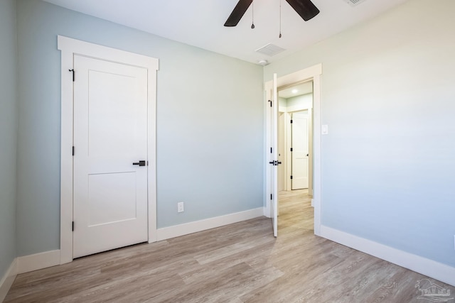 unfurnished bedroom featuring light hardwood / wood-style floors and ceiling fan