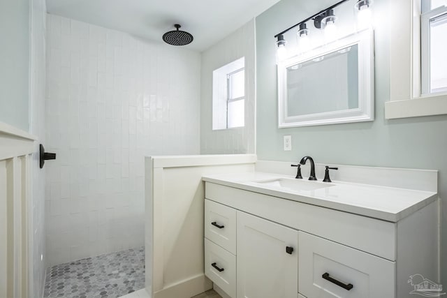 bathroom featuring vanity and a tile shower