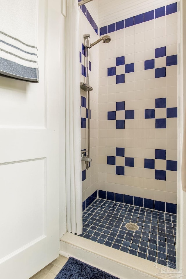 full bath featuring tiled shower