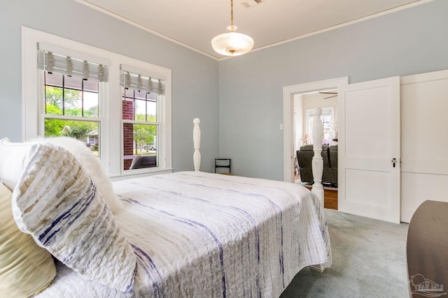 carpeted bedroom featuring visible vents and ornamental molding