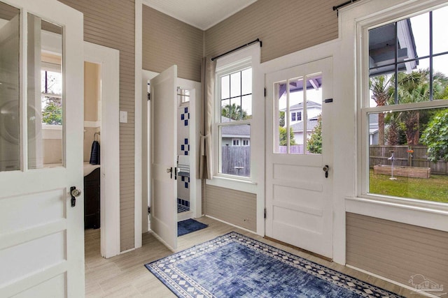 doorway to outside with light wood finished floors