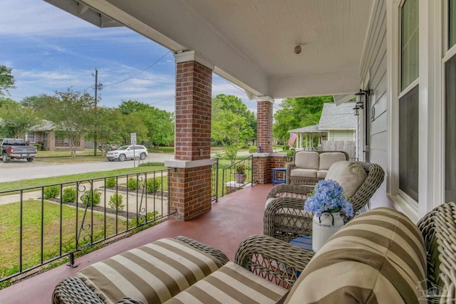 balcony featuring covered porch