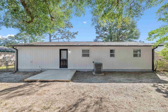 back of property with a patio area, central AC, and fence