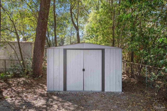 view of shed featuring a fenced backyard