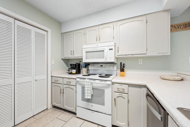 8425 Gulf Blvd Unit 213, Navarre Beach, FL 32566 - kitchen with white appliances, light countertops, and a sink