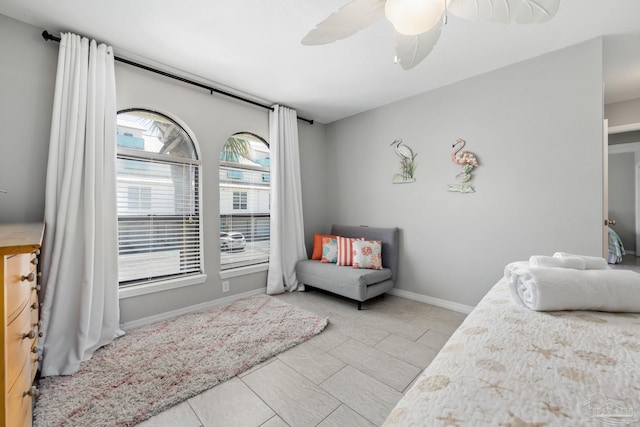8425 Gulf Blvd Unit 213, Navarre Beach, FL 32566 - bedroom with tile patterned flooring, a ceiling fan, and baseboards