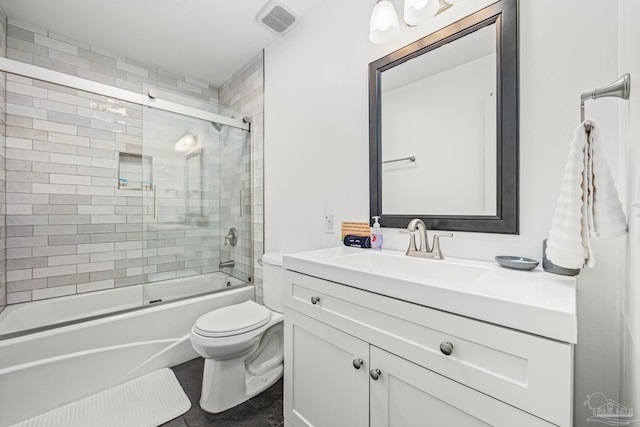 8425 Gulf Blvd Unit 213, Navarre Beach, FL 32566 - full bath featuring vanity, toilet, enclosed tub / shower combo, and tile patterned floors