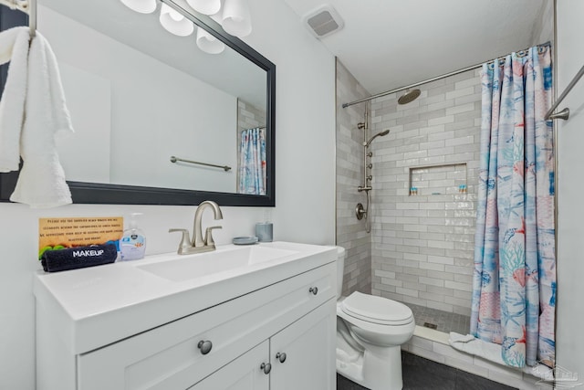 8425 Gulf Blvd Unit 213, Navarre Beach, FL 32566 - bathroom with vanity, toilet, a shower stall, and tile patterned flooring