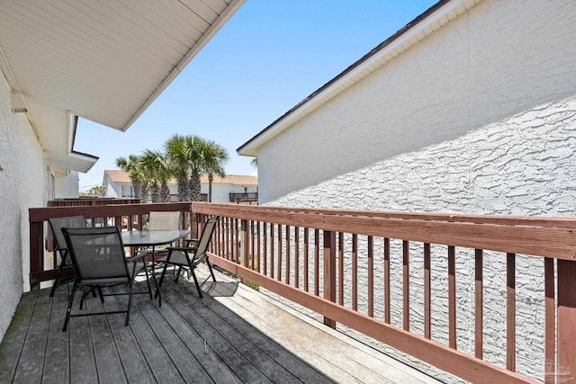 8425 Gulf Blvd Unit 213, Navarre Beach, FL 32566 - wooden deck featuring outdoor dining space