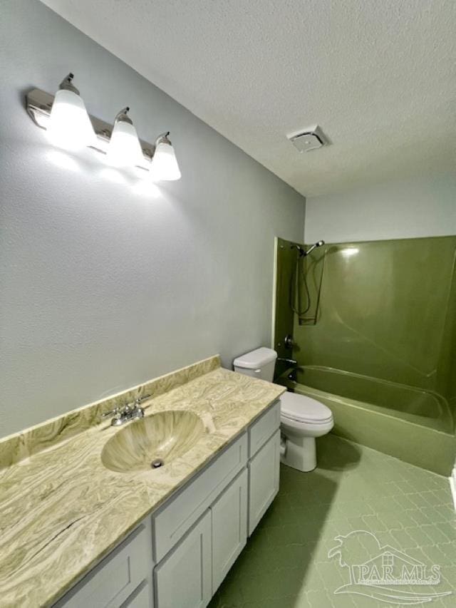 full bathroom with a textured ceiling, vanity, shower / bathtub combination, and toilet