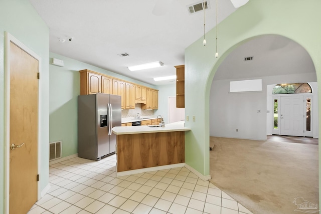 kitchen with sink, stainless steel refrigerator with ice dispenser, kitchen peninsula, light colored carpet, and light brown cabinetry