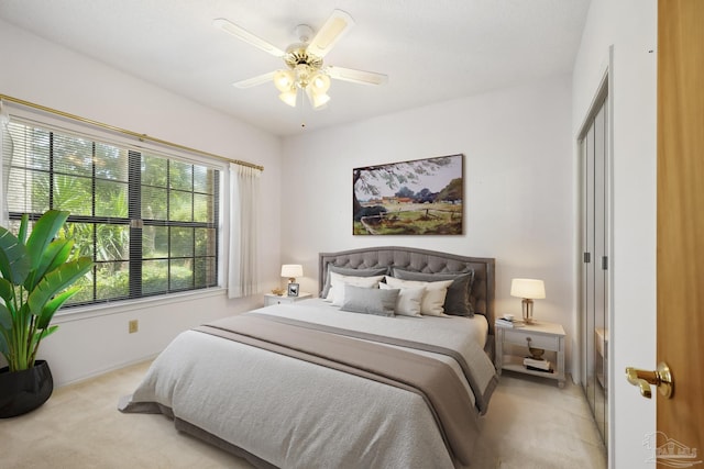 carpeted bedroom featuring ceiling fan