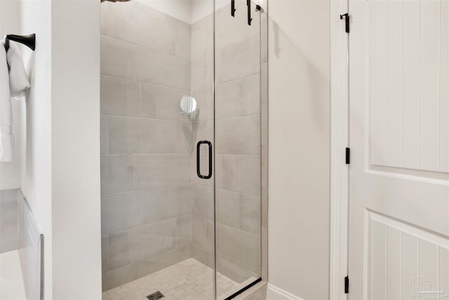 bathroom featuring an enclosed shower