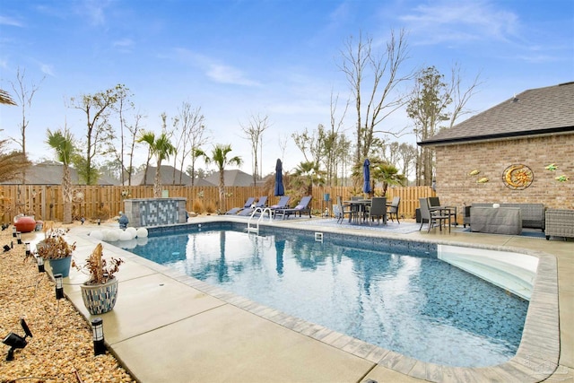 view of swimming pool with a patio area